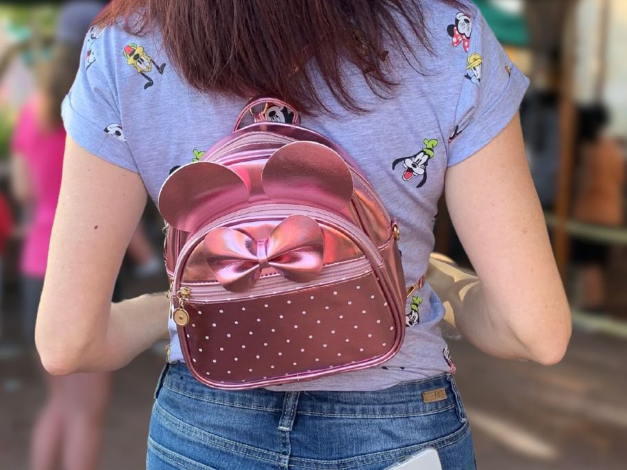 disney inspired mini backpack on woman outside