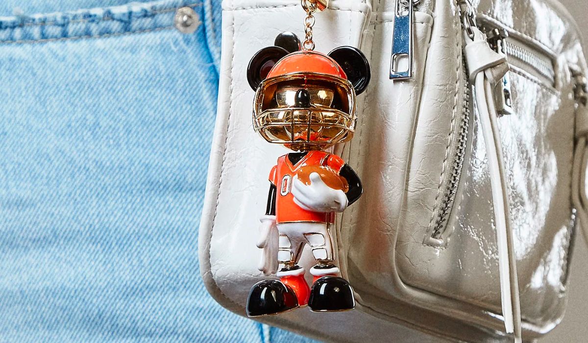 mickey bag charm on a small white handbag