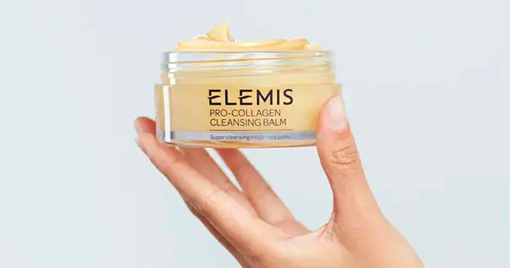 hand holding elemis collagen cleanser balm jar 