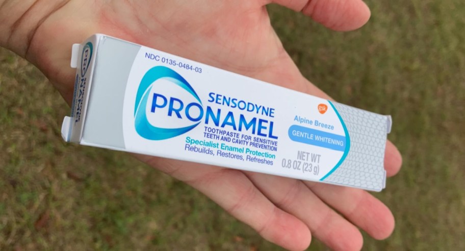 hand holding sensodyne pronamel in travel size