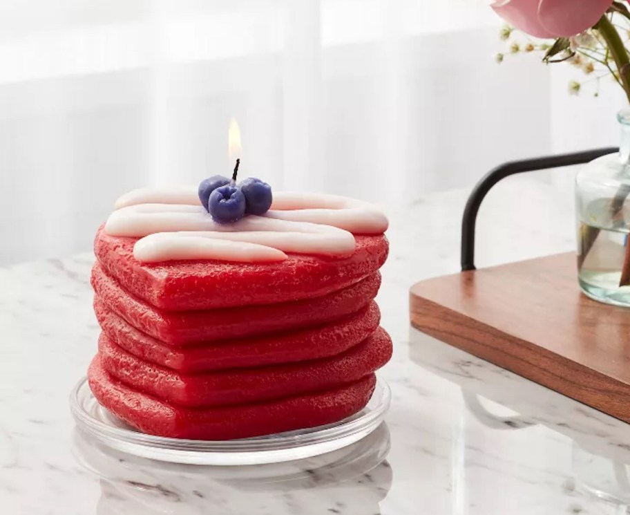 red heart shaped pancake candle on kitchen counter