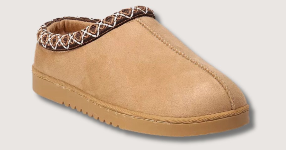 women's tan slip-in shoe with extra detailing across the foot opening and ridged sole