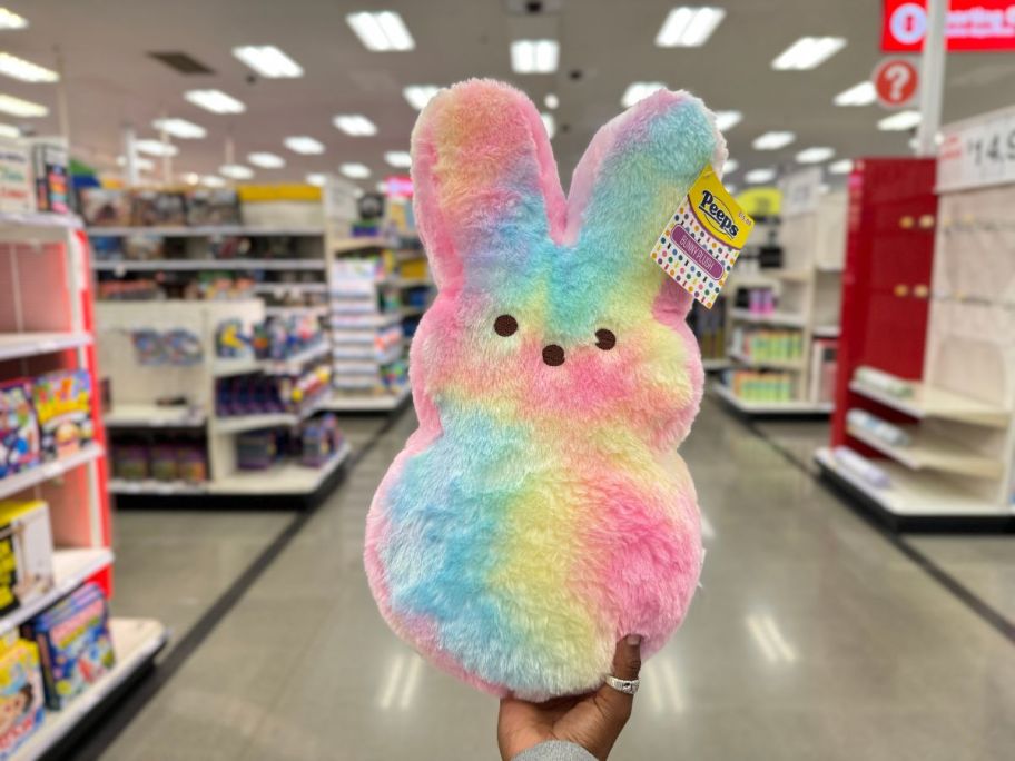 A hand holding a stuffed peep plush