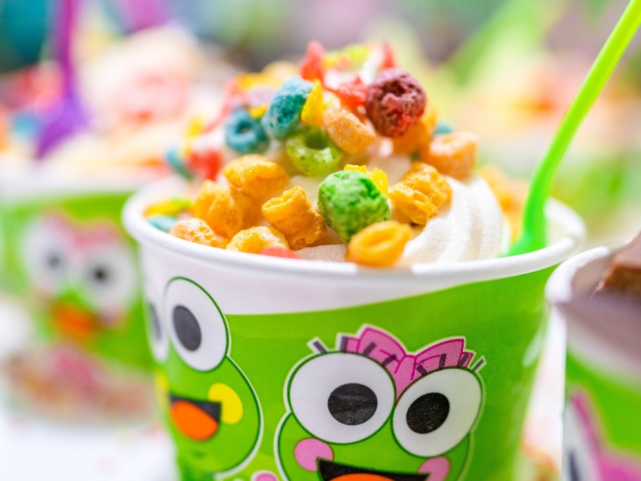 frozen yogurt topped with cereal in sweet frog cup