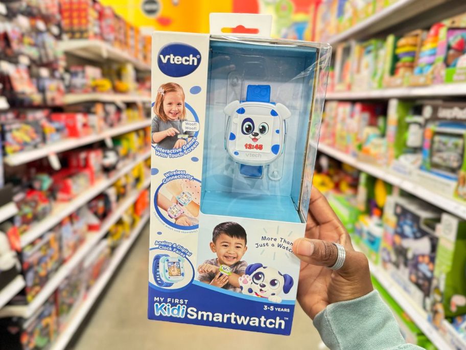 vtech smart watch being held up in store aisle