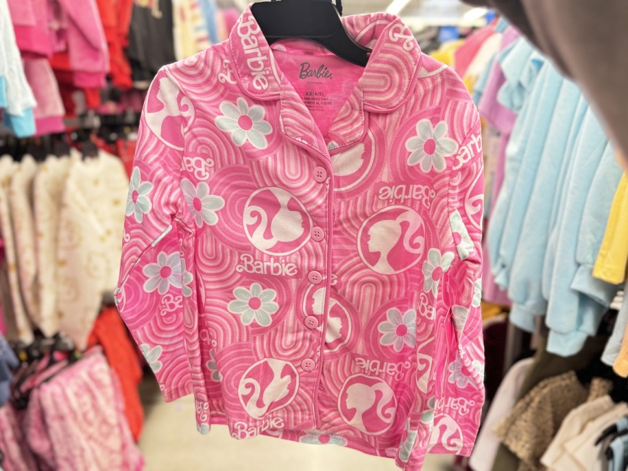 pink barbie print pajamas set on hanger