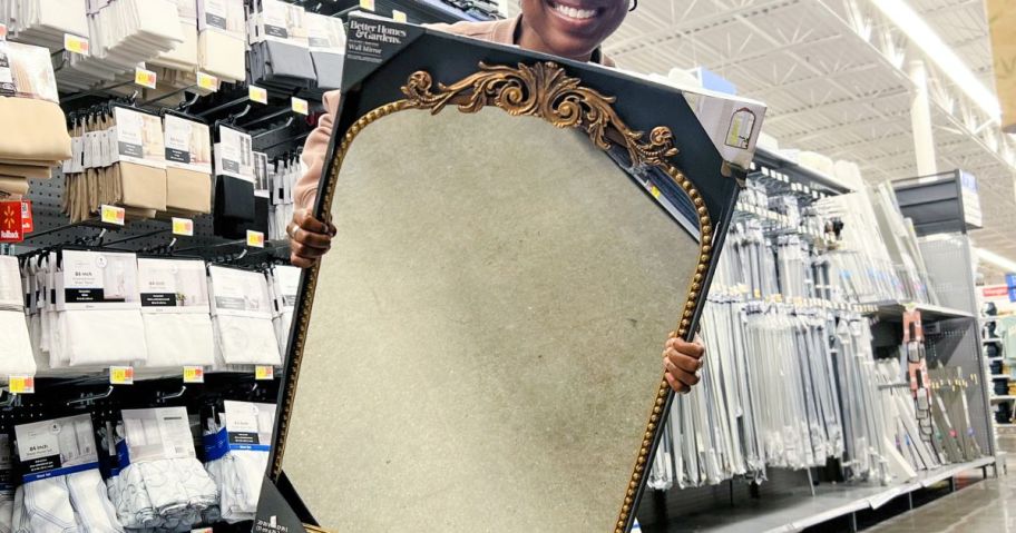 woman holding a Better Homes & Gardens Mirror from walmart