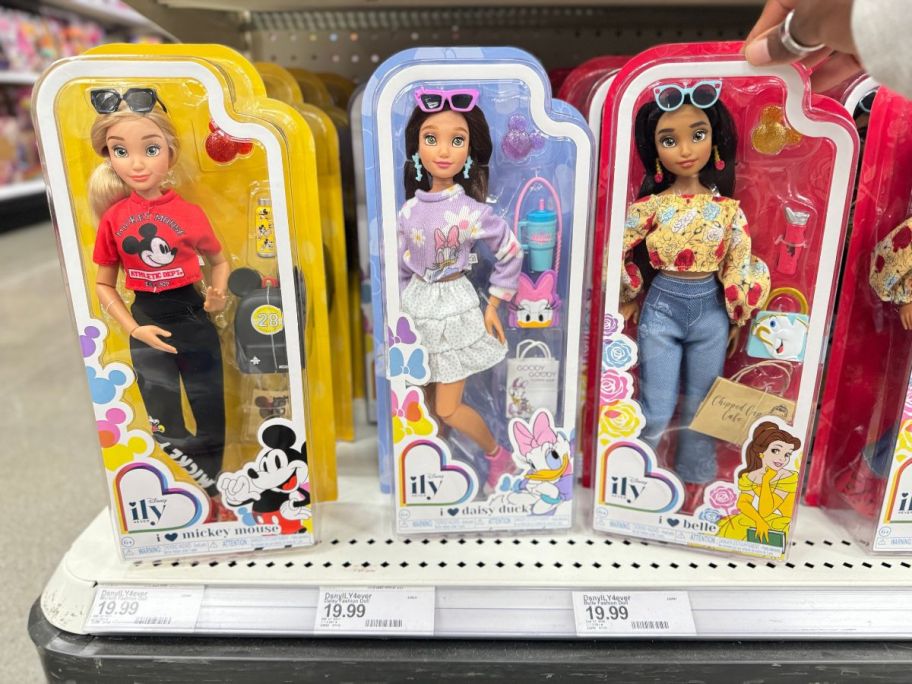 three Disney ILY 4EVER Dolls on shelf in store