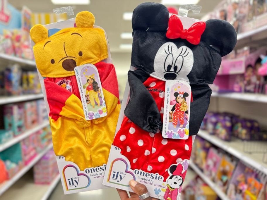 Disney ILY 4EVER One-Piece Pajama Set w/ Hoodie for 18" Dolls inspired by winnie-the-pooh and minnie mouse being held by hand in store