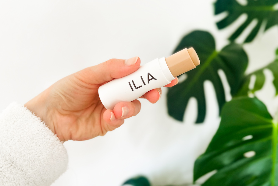 hand holding an ILIA stick foundation