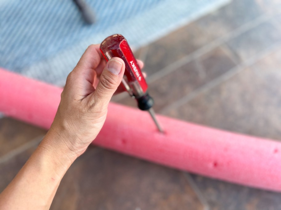 making a diy sprinkler with a dollar tree pool noodles