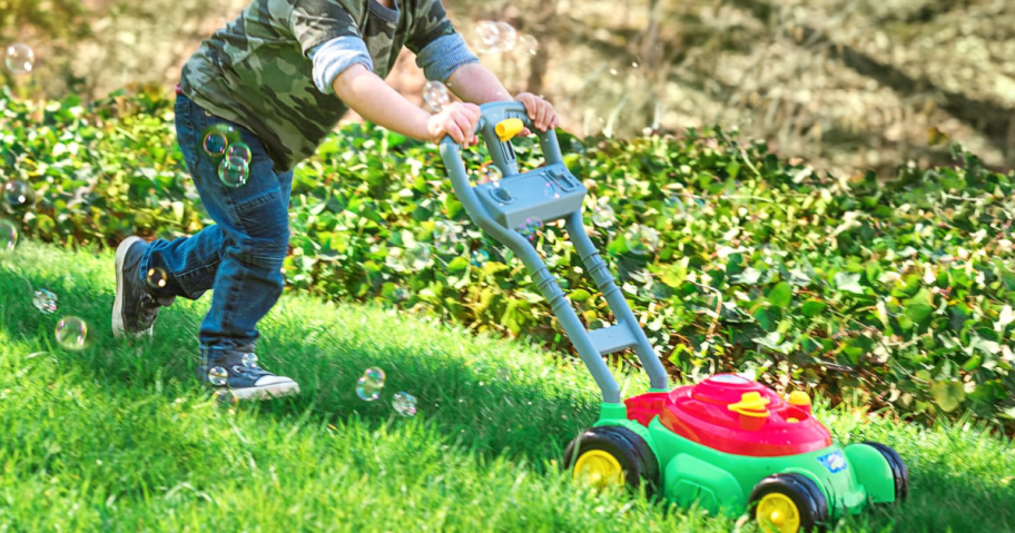 A child playing with a Deluxe Bubble Lawn Mower