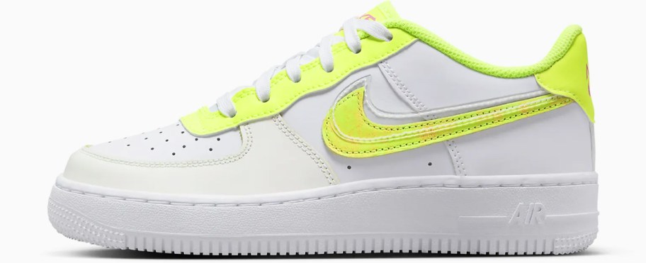 white nike sneaker with bright yellow nike symbol