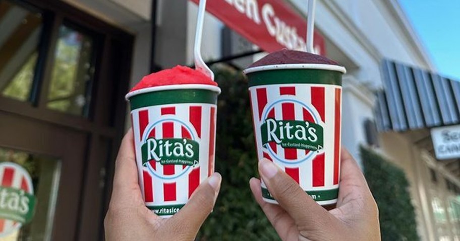 two hands holding up a rita's italian ice