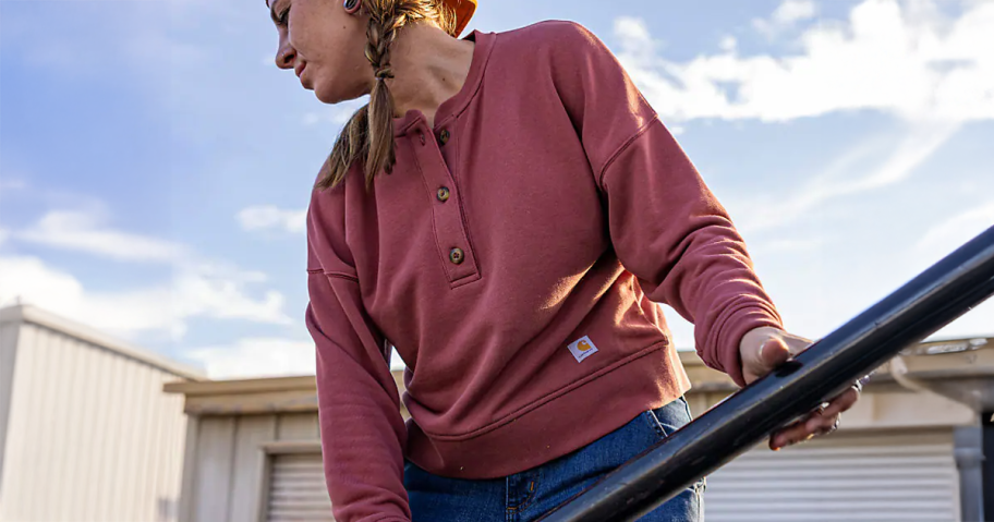 Woman wearing a Carhartt French Terry Henley Sweatshirt