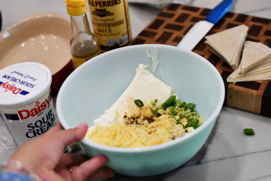 adding ingredients to a bowl