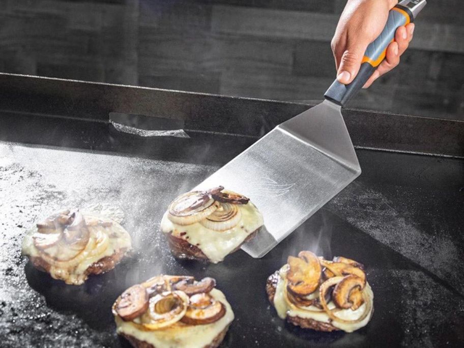 blackstone hamburger spatula flipping burgers on the griddle