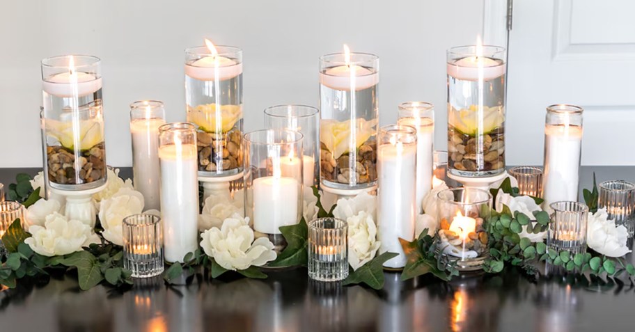 white votive and vase pillar candles on table