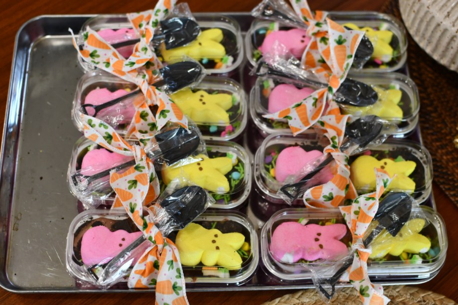 many dirt cakes in mini loaf pans with pink and yellow peep on top