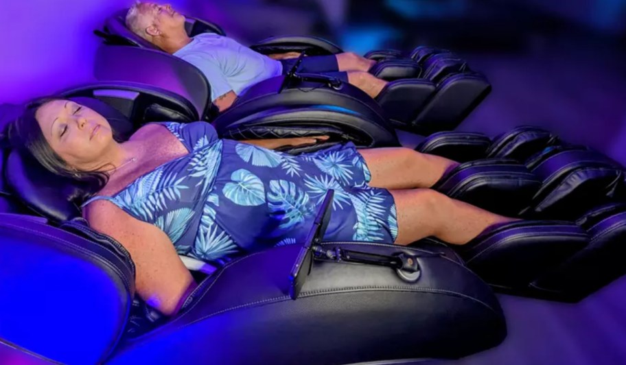 man and woman in massage chair