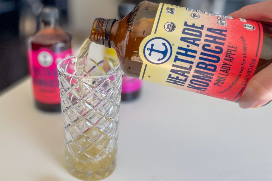 kombucha pouring into glass