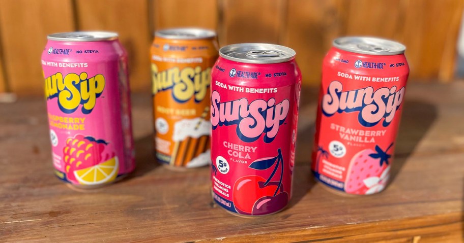 sun sip health ade cans sitting on wooden table