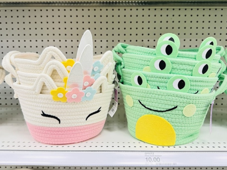 rope style baskets in the shape of a unicorn and a frog on a store shelf