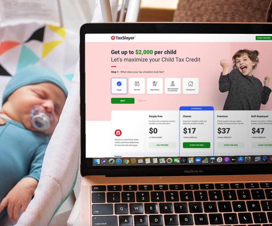 tax slayer on onlineputer screen next to baby