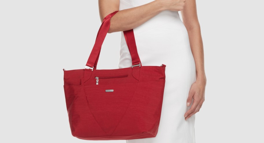 woman holding Baggallini Avenue Tote Bag