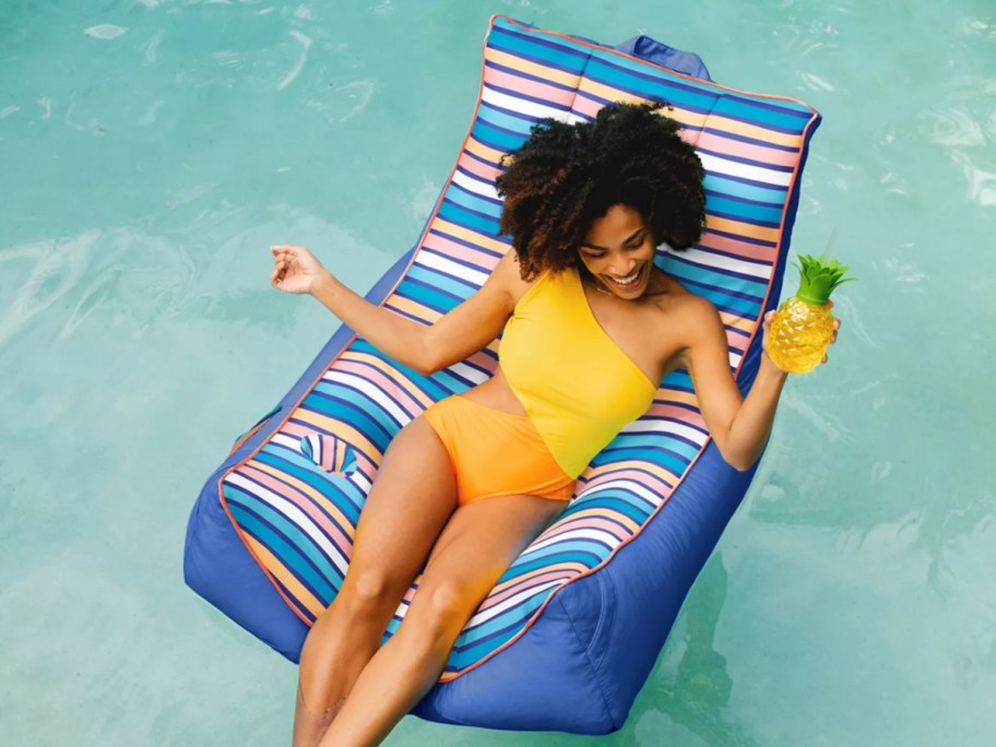 woman sitting in big joe captain's chair pool float