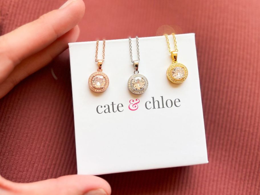 A Cate & Chloe box with 3 Blake Necklaces in different colors on it