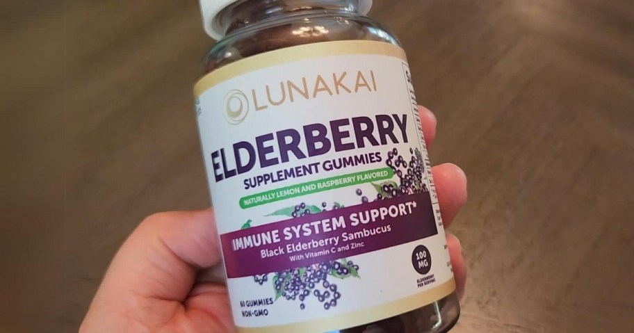 hand holding a bottle of Lunakai Sambucus Elderberry Gummies