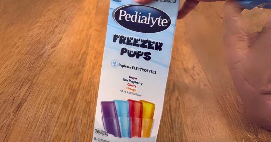 hand holding a box of Pedialyte Electrolyte Solution Freezer Pops