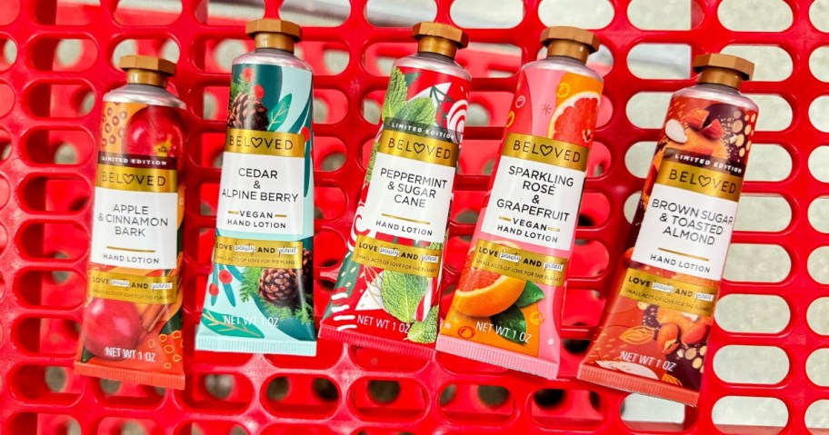 colorful tubes of hand lotion in a red Target shopping cart