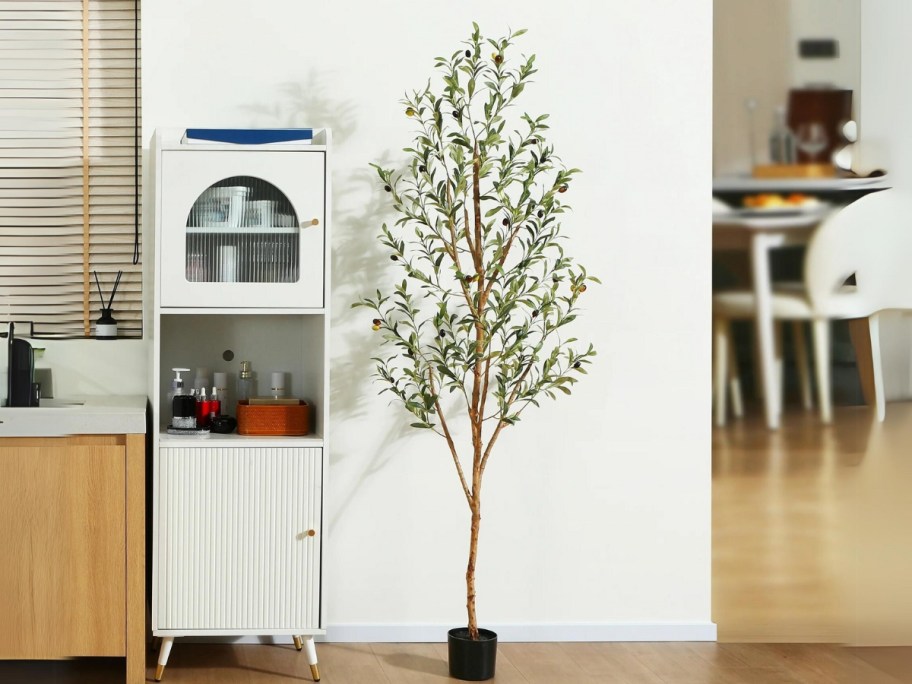 faux olive tree plant in a kitchen