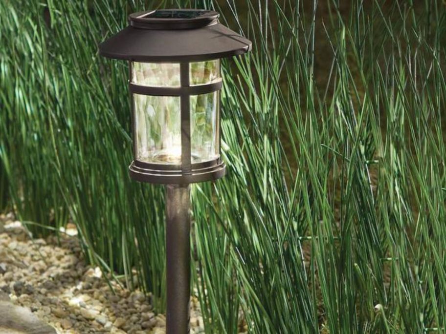 A Hampton Bay Duncan Bronze 10 Lumen LED Outdoor Solar Path Light