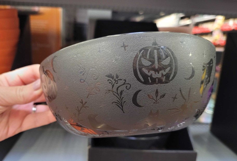 Hand holding Halloween etched bowls