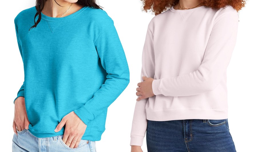 two women in blue and light pink crewneck sweatshirts