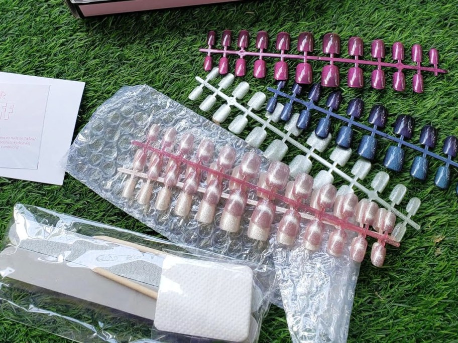 sets of press-on nails in various colors