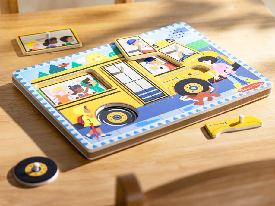 wooden school bus puzzle on table