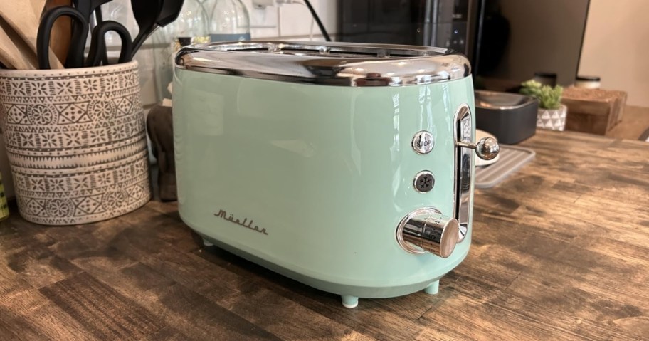 mueller retro 2-slice toaster in blue on kitchen counter