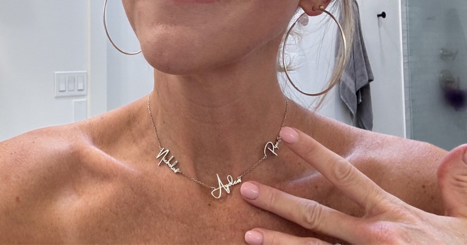 woman wearing silver name necklace