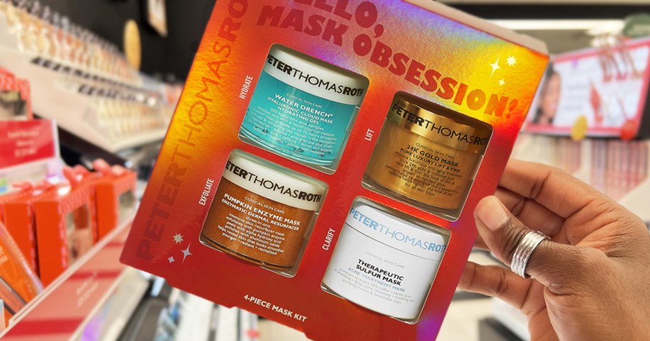 hand holding up a Peter Thomas Roth 4-piece face mask gift set