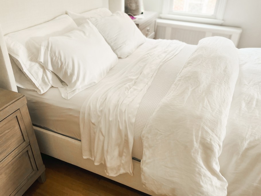 bed made with white sheets and onlineforter