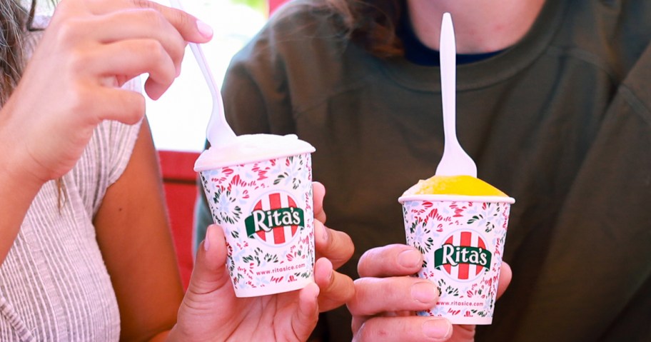 two people holding cups of Rita's Italian Ice