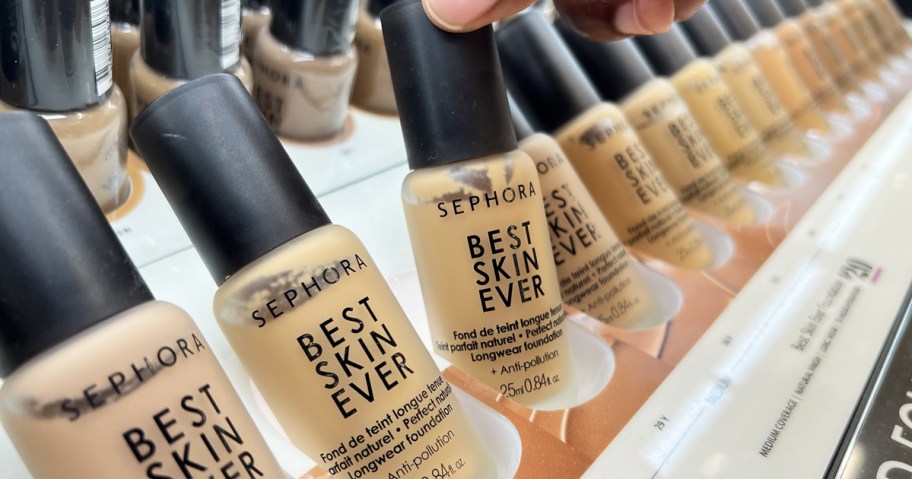 hand grabbing bottle of Sephora Collection Best Skin Ever Liquid Foundation