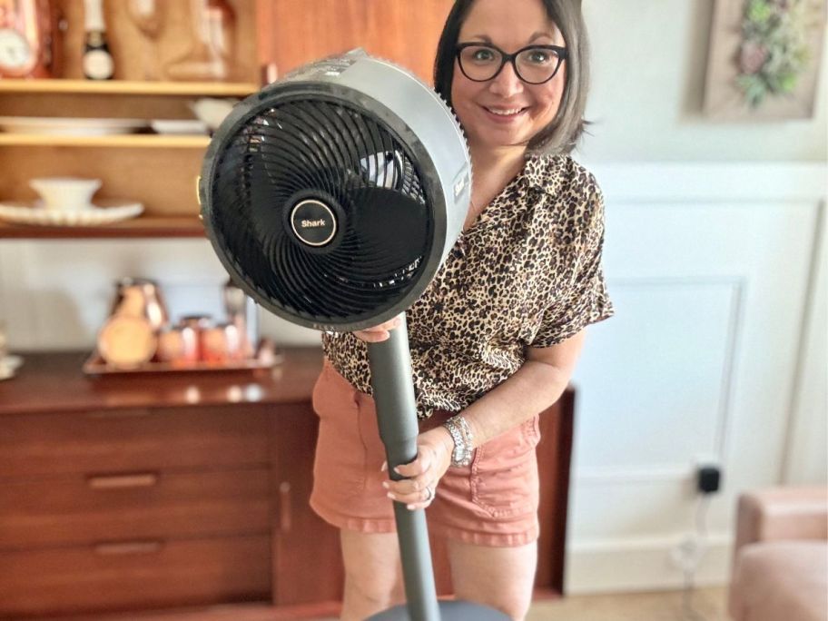 Woman holding the Shark FlexBreeze Fan