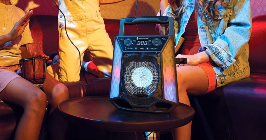 a group of kids having fun and singing with a Singing Machine Karaoke Machine 