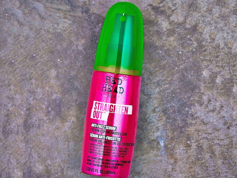 pink and green bottle of TIGI Bed Head Straighten Out Anti Frizz Serum