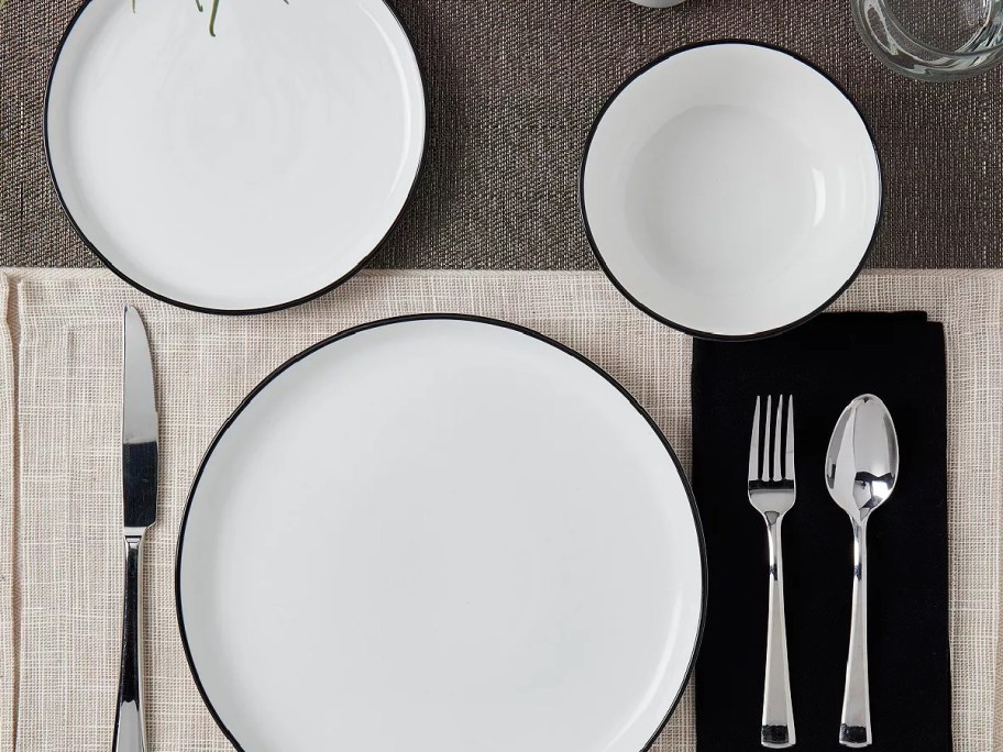 Tabletops Unlimited Black Rim Dinnerware 12 Piece Set displayed on the table